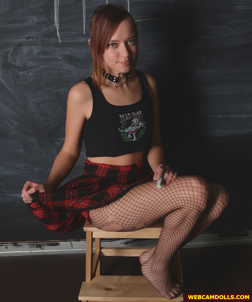 Redhead Schoolgirl in Black Ripped Fishnet Pantyhose and Miniskirt on Webcamdolls